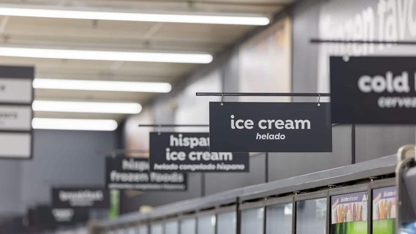 Supermarket signage design for ice cream displays. White text on black background provides a legible contrast.